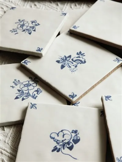 Blue and white hand-painted floral tiles